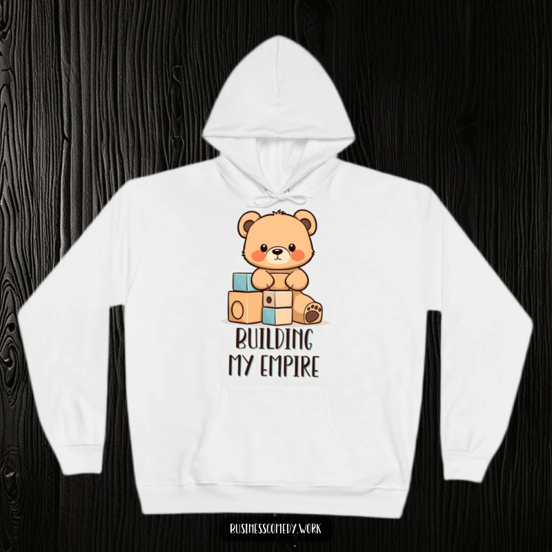 Funny hoodie design featuring a concentrated bear cub cub building a tower of blocks, exuding determination and cuteness.
