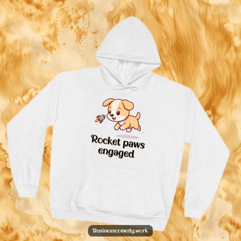 Funny hoodie graphic of a happy puppy chasing after a small rocket emblem, exuding joy and playfulness.